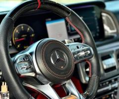 إيجار سيارة المشاهير (G63): خدمة بالسائق VIP لضمان راحة وخصوصية التنقل من المطار.