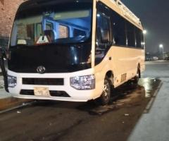 Toyota Coaster for Rent: Luxury Bus Experience with Private Driver.