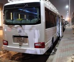 Rent a Toyota Coaster with a driver for premium large-group tours and events.