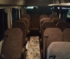 Rent a Toyota Coaster with a driver for premium large-group tours and events.